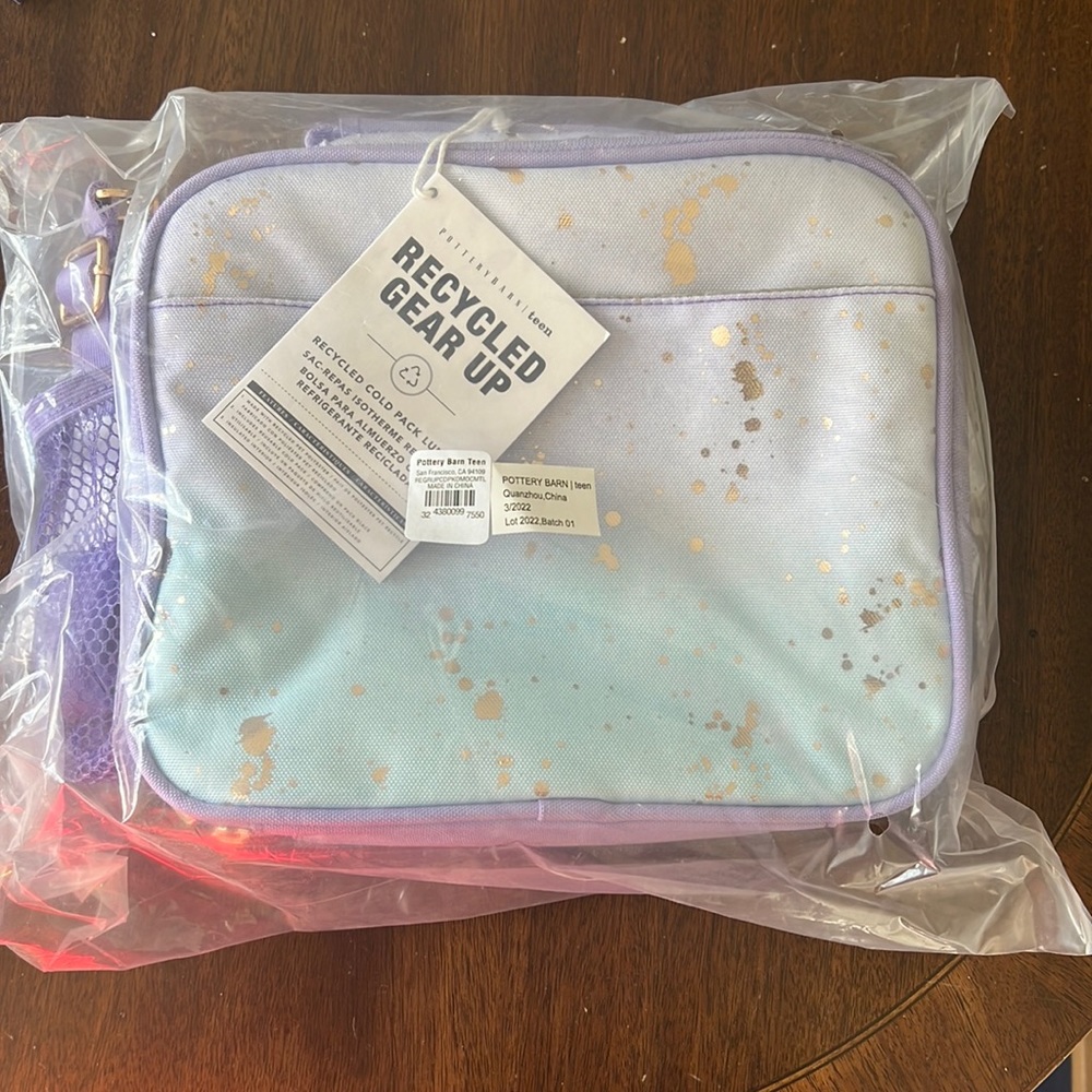 Brand new pottery barn teen lunch box purple and blue splatter with gold.